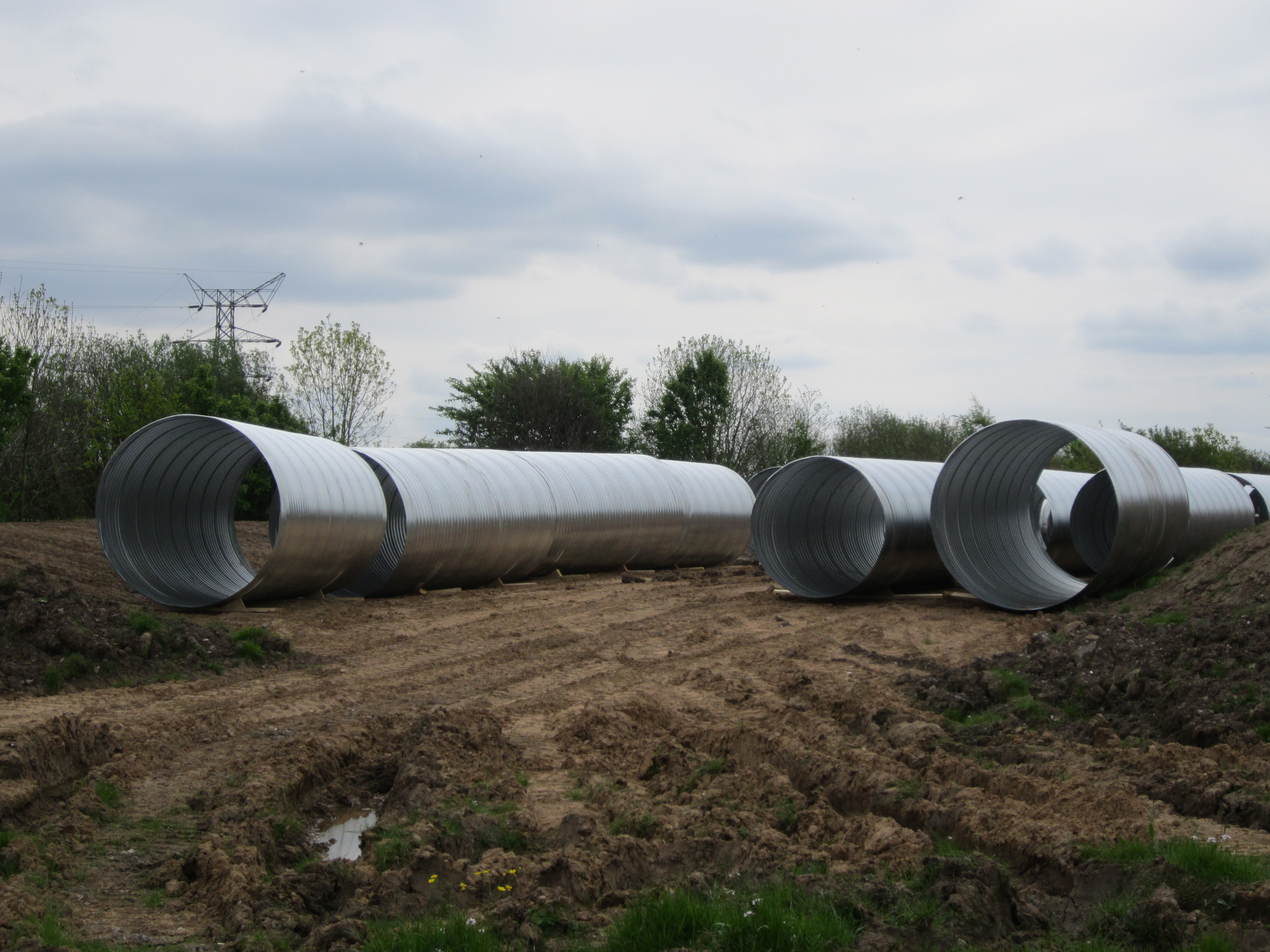 Corrugated steel culvert pipes at a construction site